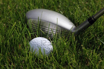 golf-hybrid-club-with-a-golf-ball-lying-in-low-rough